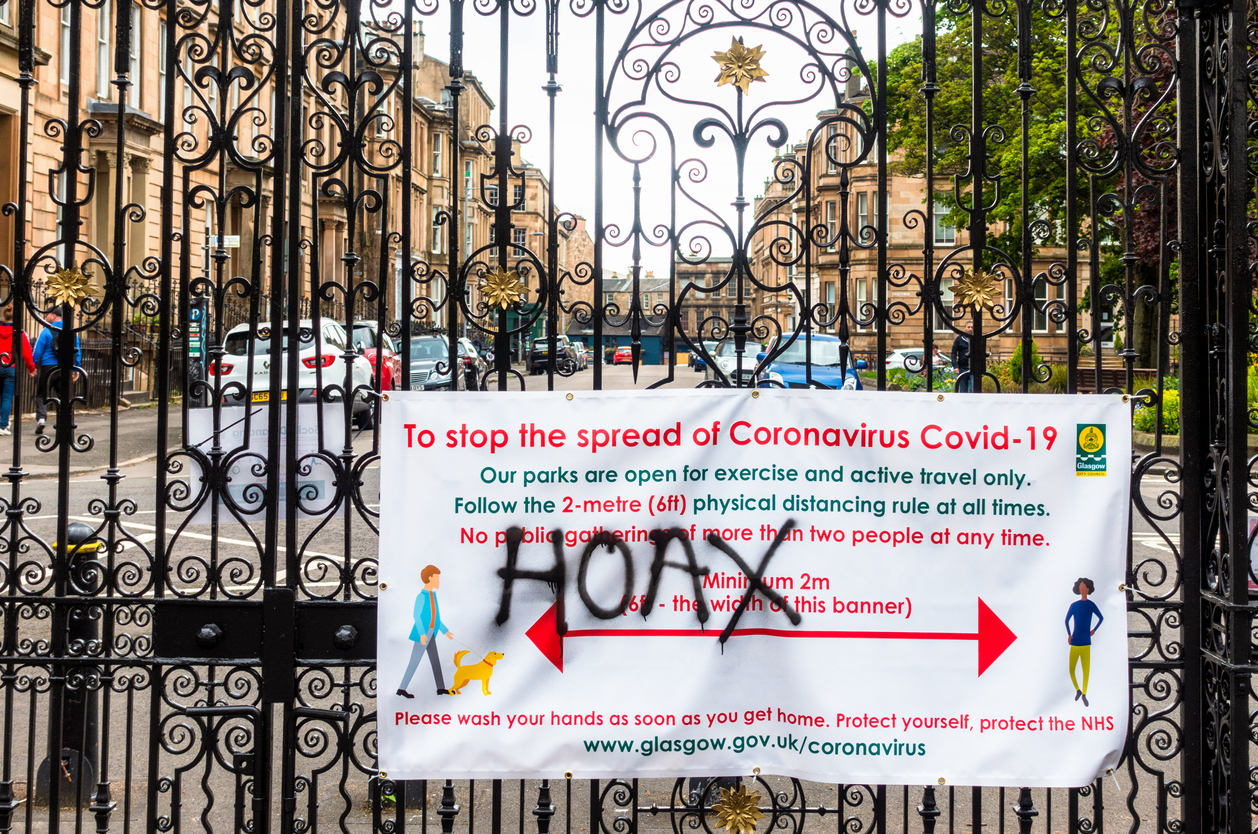 'Hoax' spray painted over Covid-19 information sign